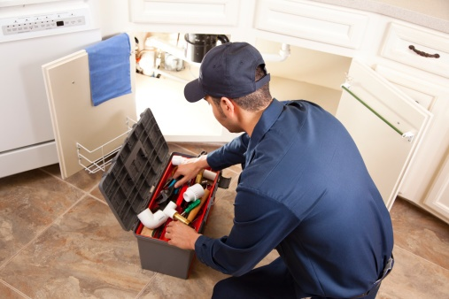 A plumber fixing leaking issues 