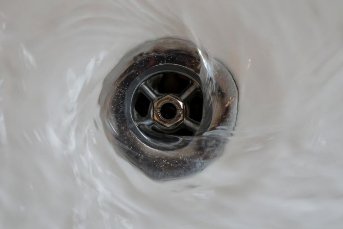 Your Money Down the Drain: Why Chemical Drain Cleaners Are a Bad Idea