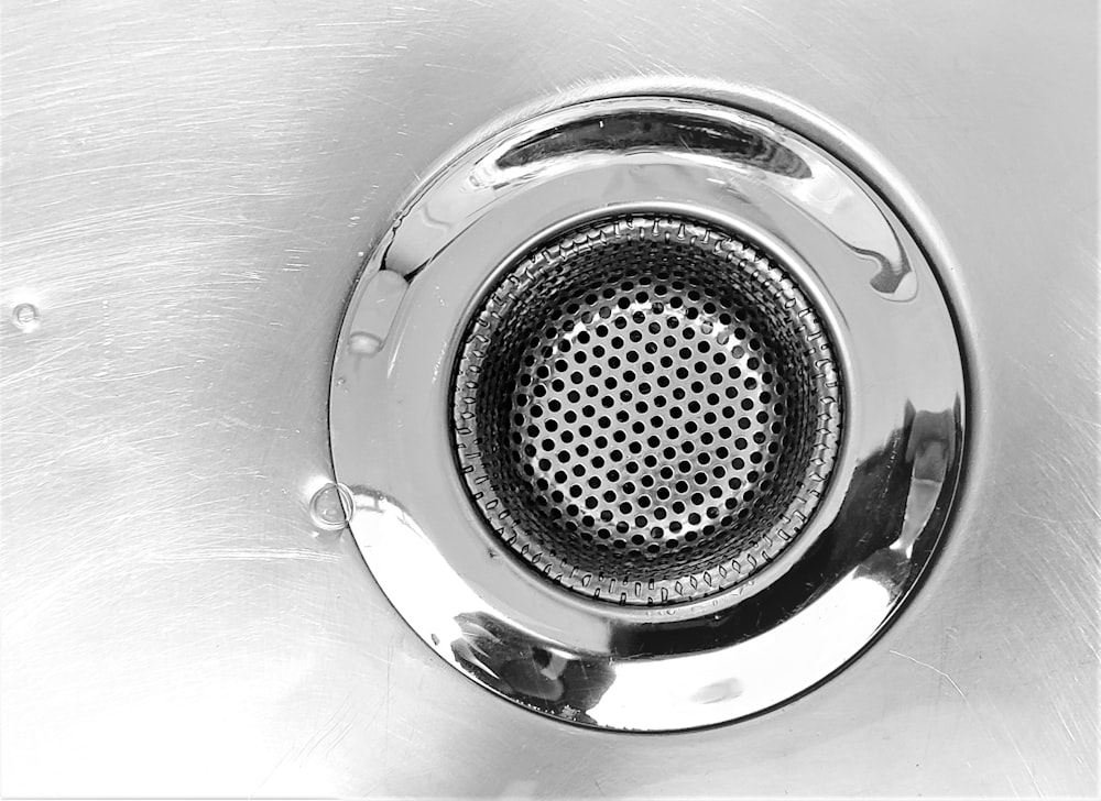 A Closeup Of A Clean Metal Sink Drain