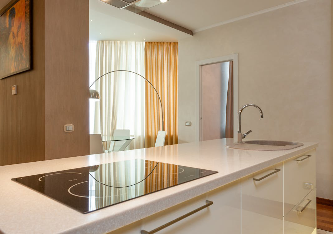 An Image Of A Modern Kitchen With A Built In Stove And Sink