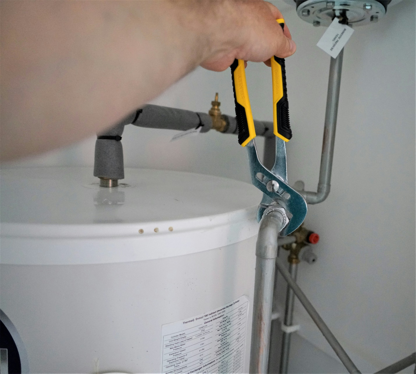 A Plumber Working With Tools